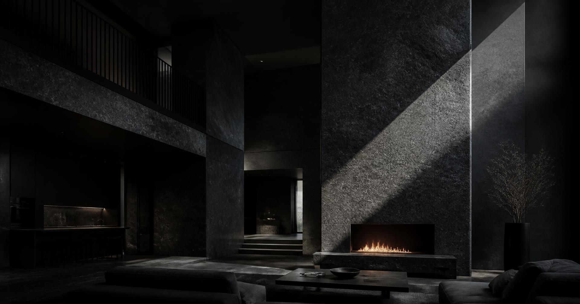 Double-height granite living space cut by a single shaft of daylight